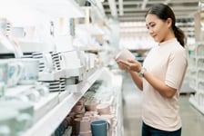 Woman looking at products in store aisle
