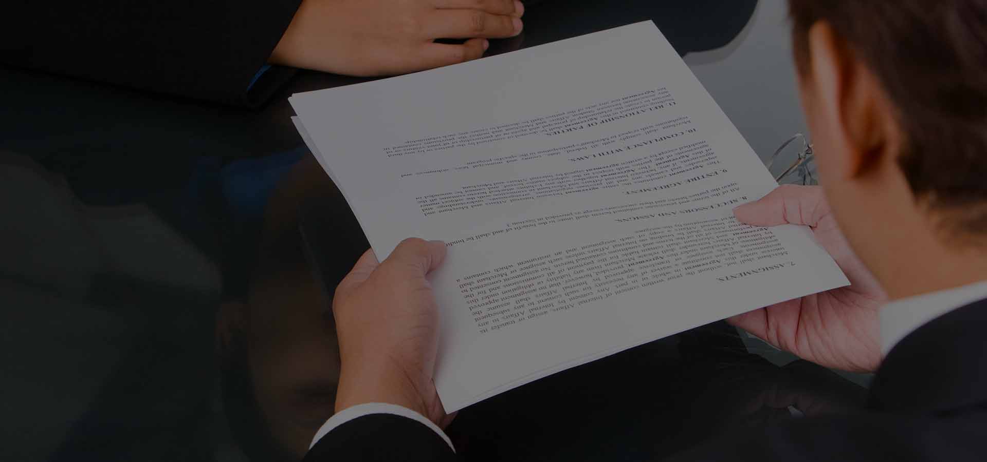 man handing document to client 