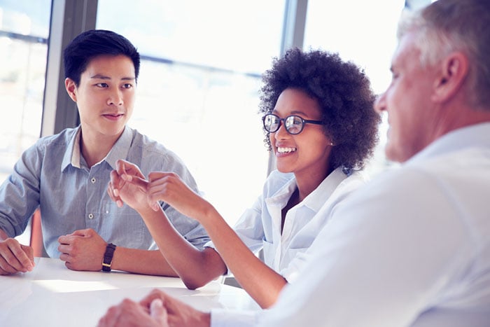 three people talking