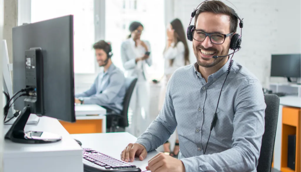 man with headphones transcribing